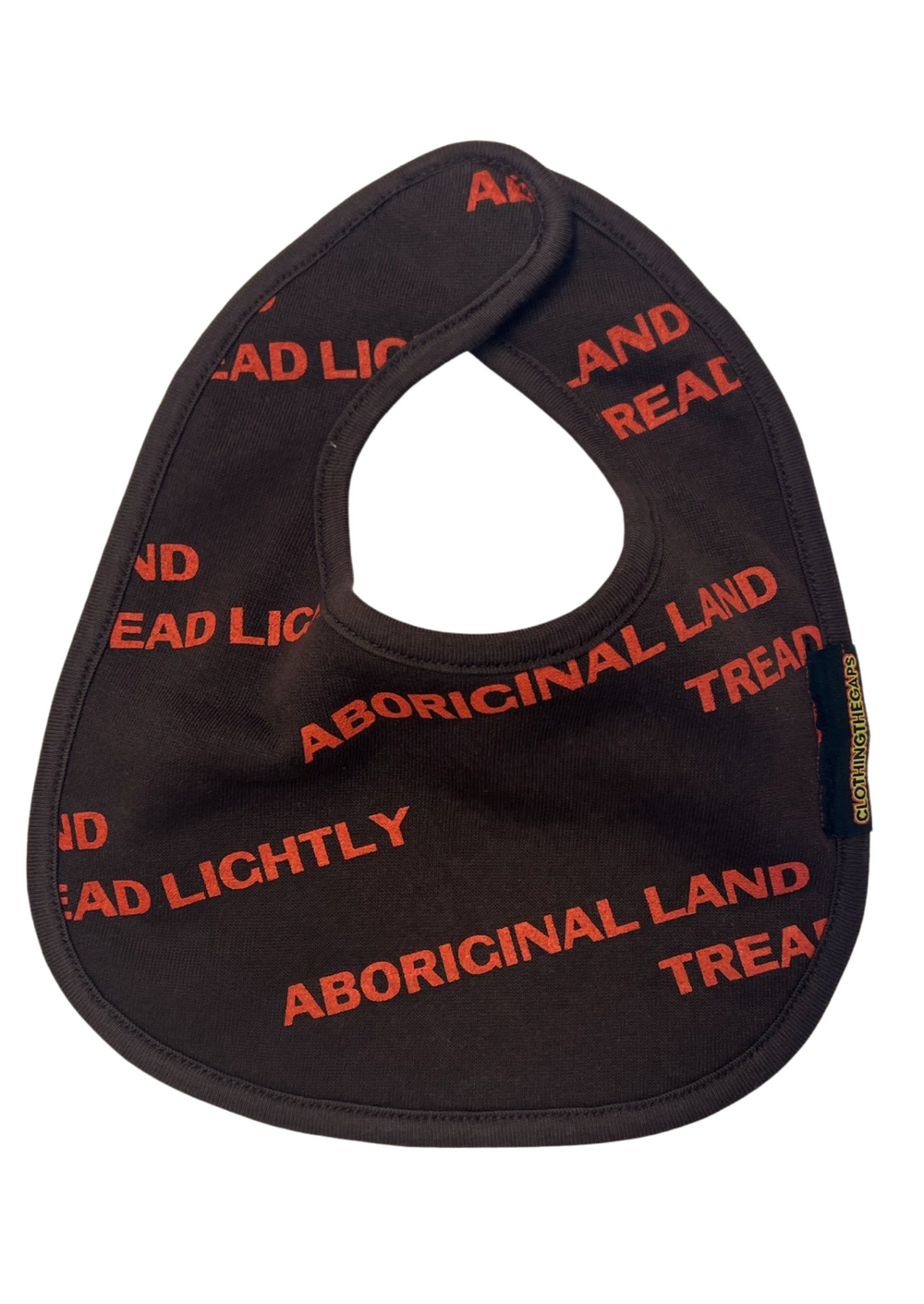 Clothing The Gaps. Bubup Tread Lightly baby bibs. Comes in orange/brown and orange/blue Chocolate Brown bib with repeating pattern all over crew of the words 'Aboriginal Land Tread Lightly' text in a light blue colour or orange colour. Includes Velcro to attach around babies neck.