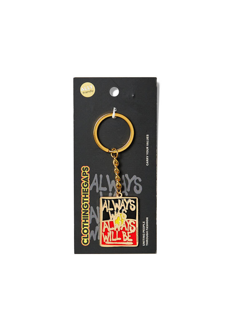Clothing The Gaps. Keyring with gold chain and loop attached to rectangle shaped Black, yellow and red 'always was always will be' text outlined in gold.