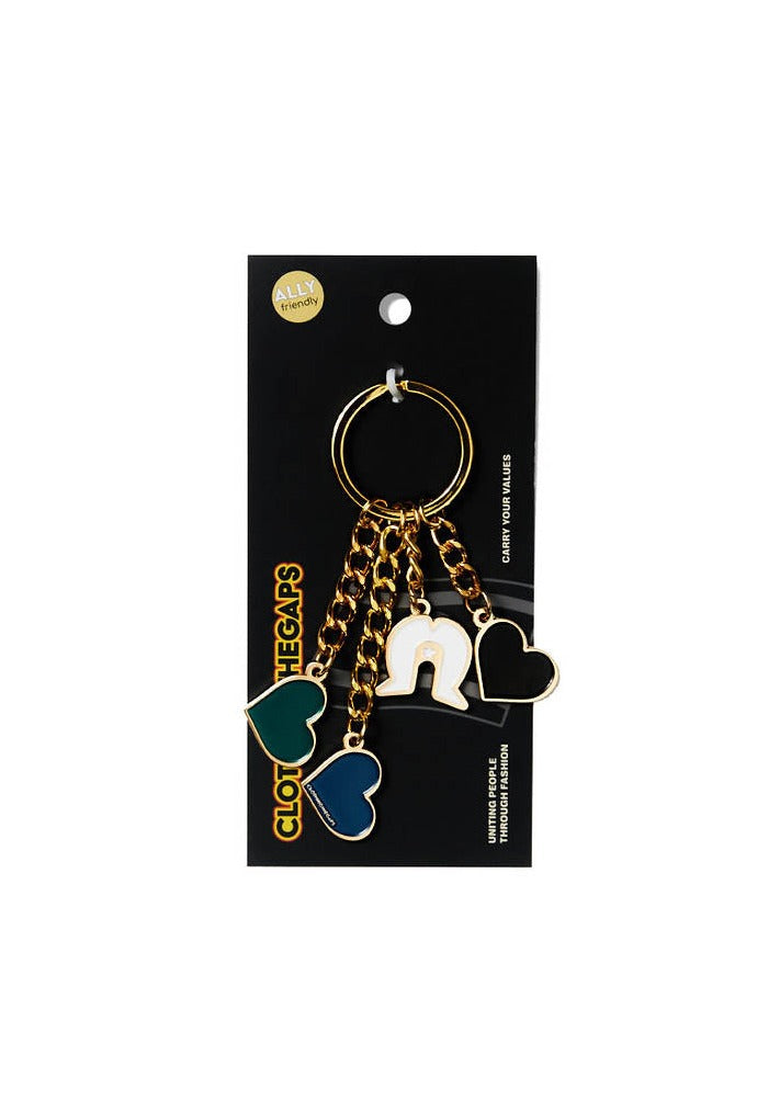 Clothing The Gaps. Our Islands Our Home Keyring.  With gold chain and loop attached to 3 seperate hearts and a white Dhari in the colours off the Torres Strait Islander flag Black, Green and Blue.