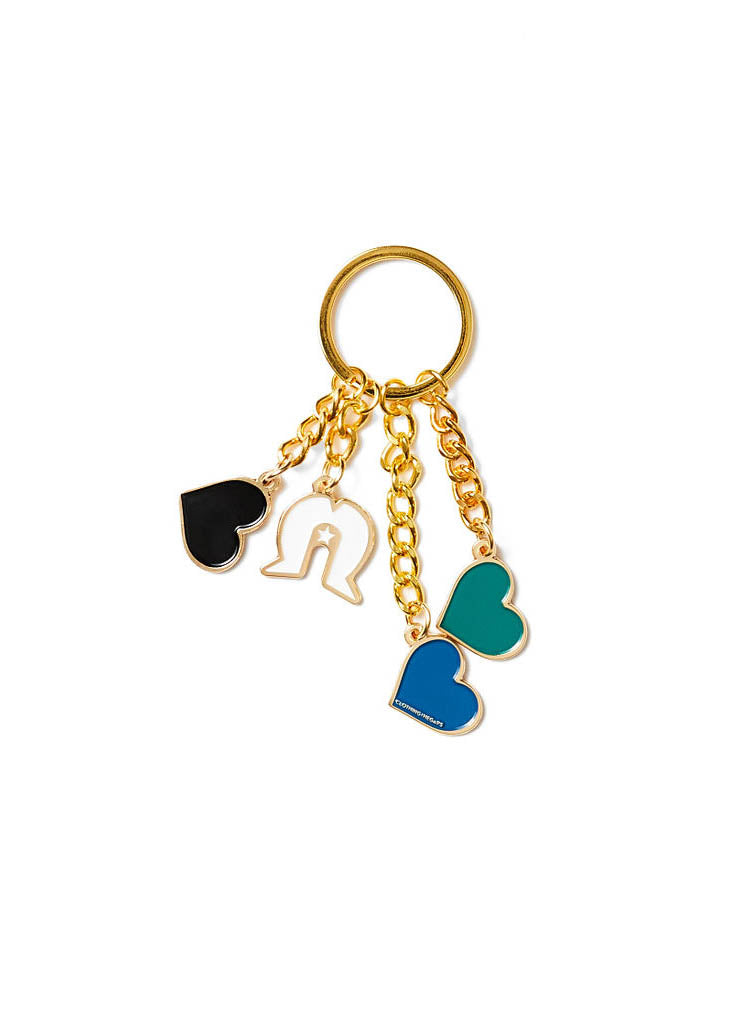 Clothing The Gaps. Our Islands Our Home Keyring.  With gold chain and loop attached to 3 seperate hearts and a white Dhari in the colours off the Torres Strait Islander flag Black, Green and Blue.