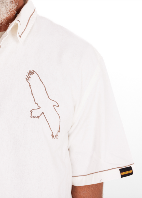 White shirt with an eagle emblem on a white background