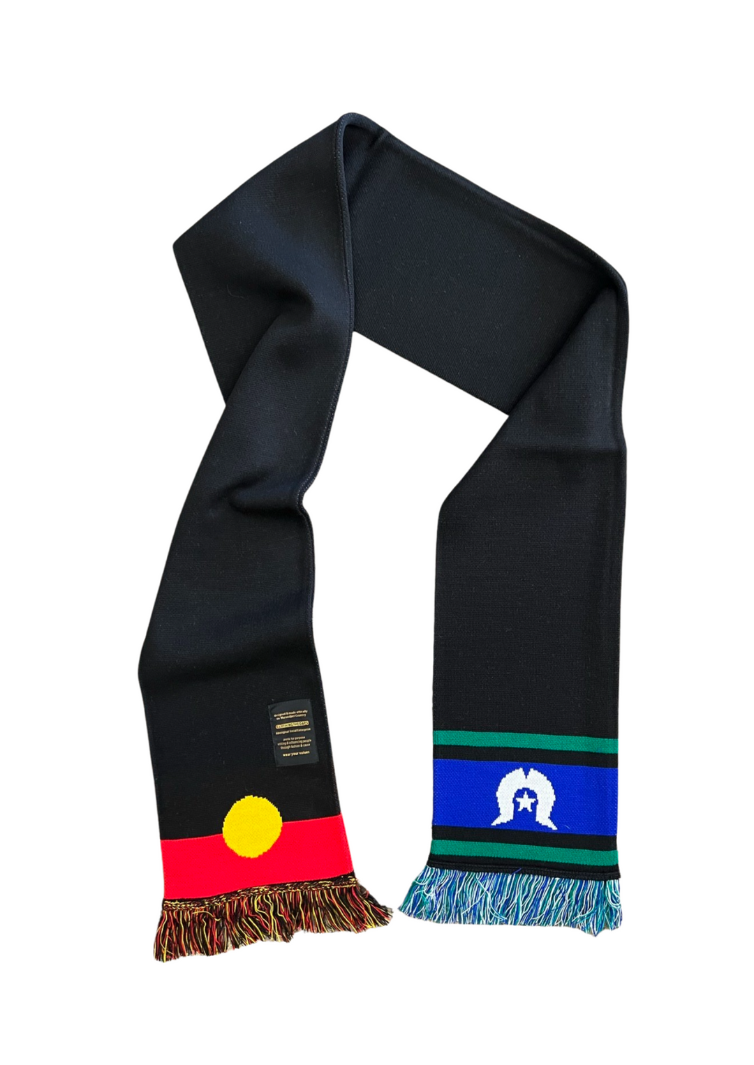 Clothing The Gaps. Represent Scarf. Thick black long scarf with aboriginal flag at one ends and Torres strait islander flag at other end. With red, black and yellow strings at aboriginal flag end and green, white and blue strings at end of Torres strait islender flag end. 