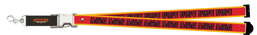 Clothing The Gaps. Power Lanyard. Thick strap with black 'always was' text on a red background with a yellow trim repeated. With an extra large silver metal clasp and engraved with the Clothing The Gaps logo. Black safety clip at back of neck. Silver metal clip at end of lanyard to attach what you would like.