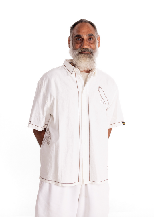 Man wearing a white clothing the gaps spirit shirt on a white background