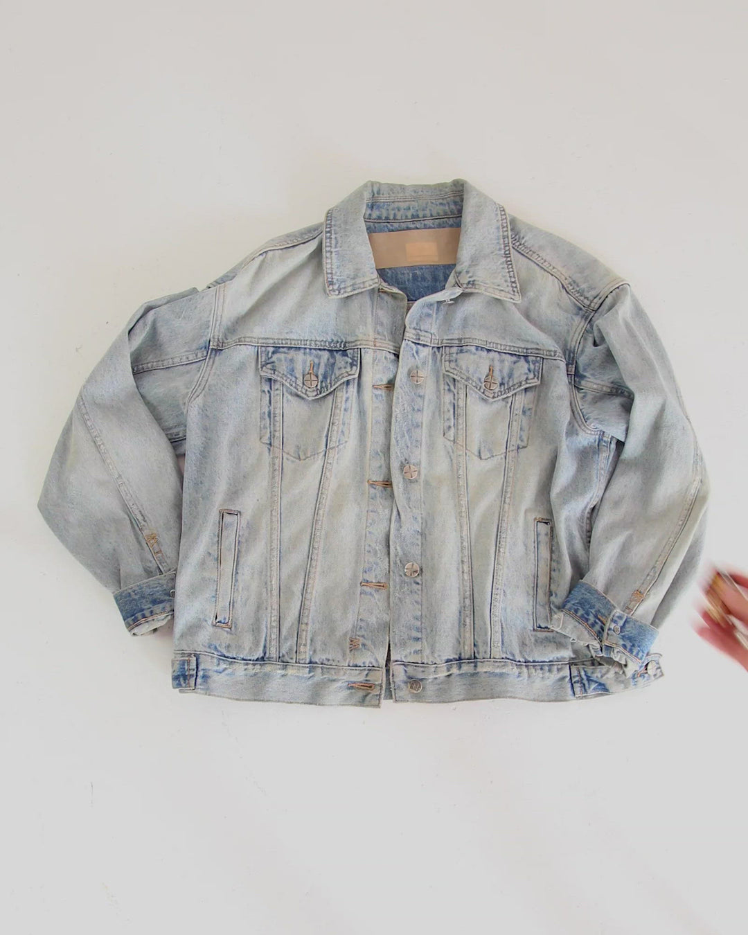 Clothing The gaps. Resistance Pin. Detailed brown resistance fist with red, black and yellow painted nails and aboriginal flag on wrist of fist. With gold outlines and backing.