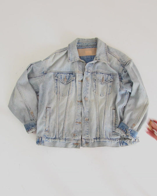 Clothing The gaps. Resistance Pin. Detailed brown resistance fist with red, black and yellow painted nails and aboriginal flag on wrist of fist. With gold outlines and backing.