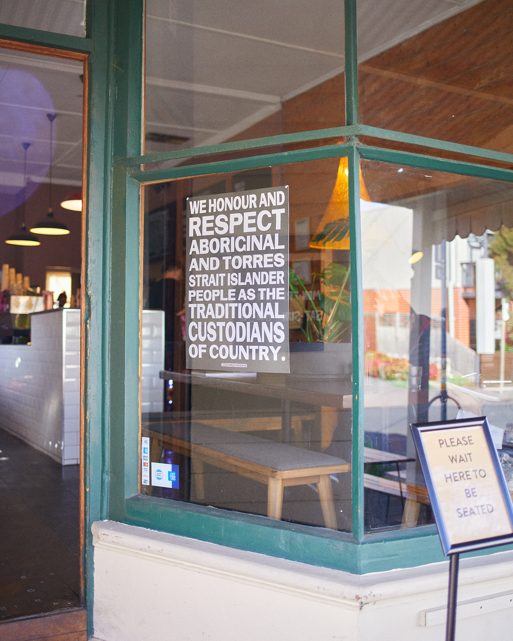 Clothing The Gaps. Honour Country Posters. Poster text 'Honour and respect Aboriginal and Torres Strait Islander people as the rightful custodians of country.' Available in Black/ White black background poster with white bold capital text and Pink/Red pink background background poster with red bold capital text.