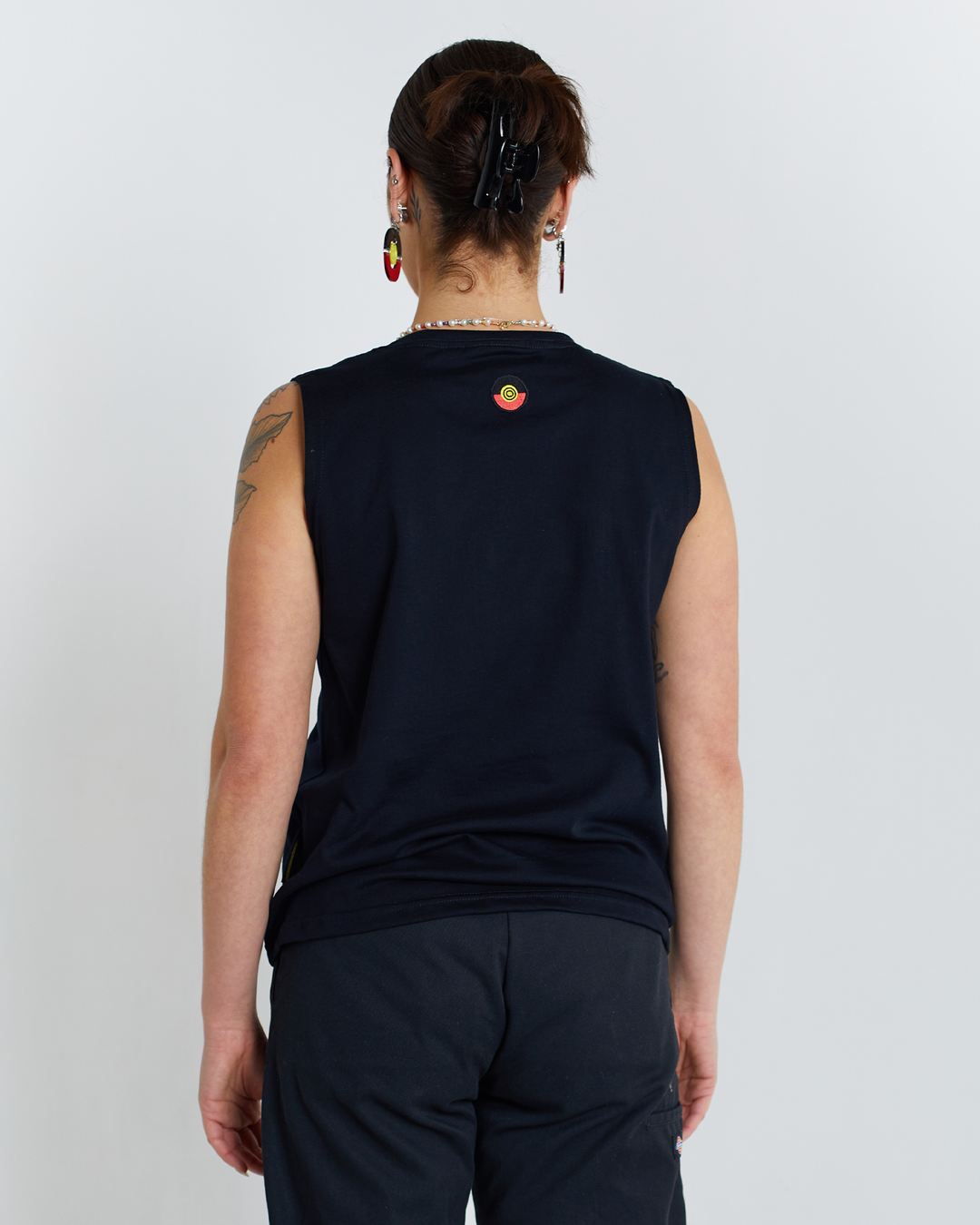 Clothing The Gaps. Blak Luv Tank. All black tank with  Red, black and yellow hearts embroiled on front.