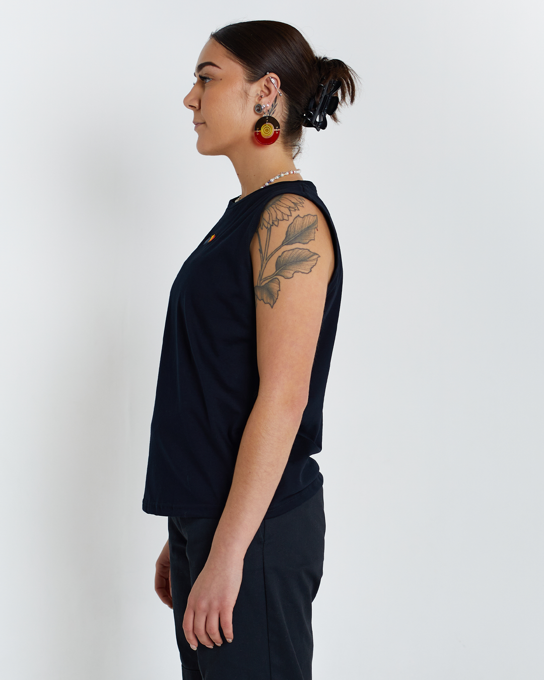 Clothing The Gaps. Blak Luv Tank. All black tank with  Red, black and yellow hearts embroiled on front.