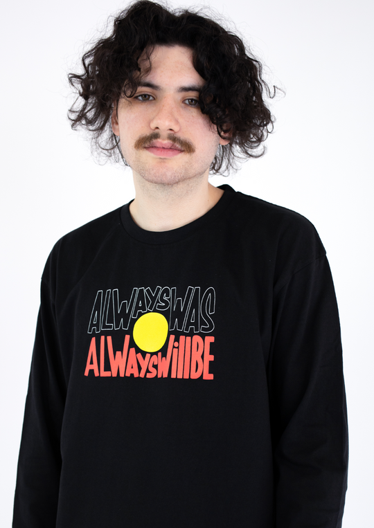 Clothing The Gaps. Black long sleeve T-shirt with Black, yellow and red 'always was always will be' text screen printed in centre.