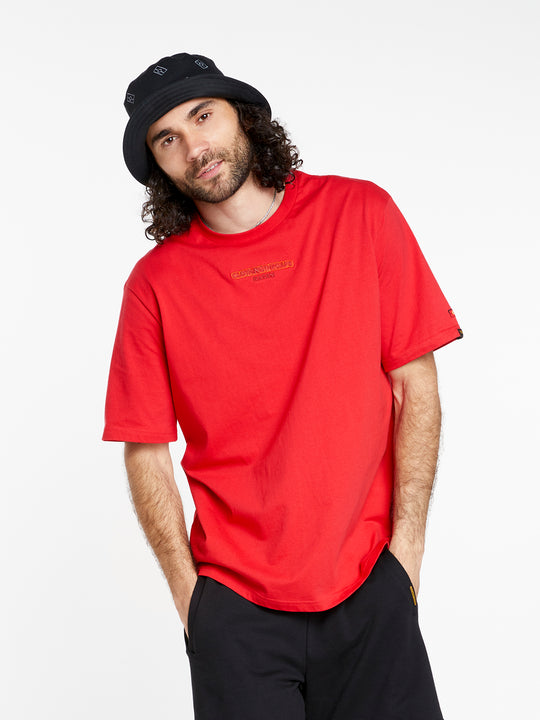Clothing The Gaps. Land Tee. Red T-shirt. With embroidered 'Clothing The Gaps' on front chest with minimalist font in a contrasting light red colour and 'Narrm' in a dark red embroidered underneath, acknowledging the land on which Clothing The Gaps operates it's social enterprise.