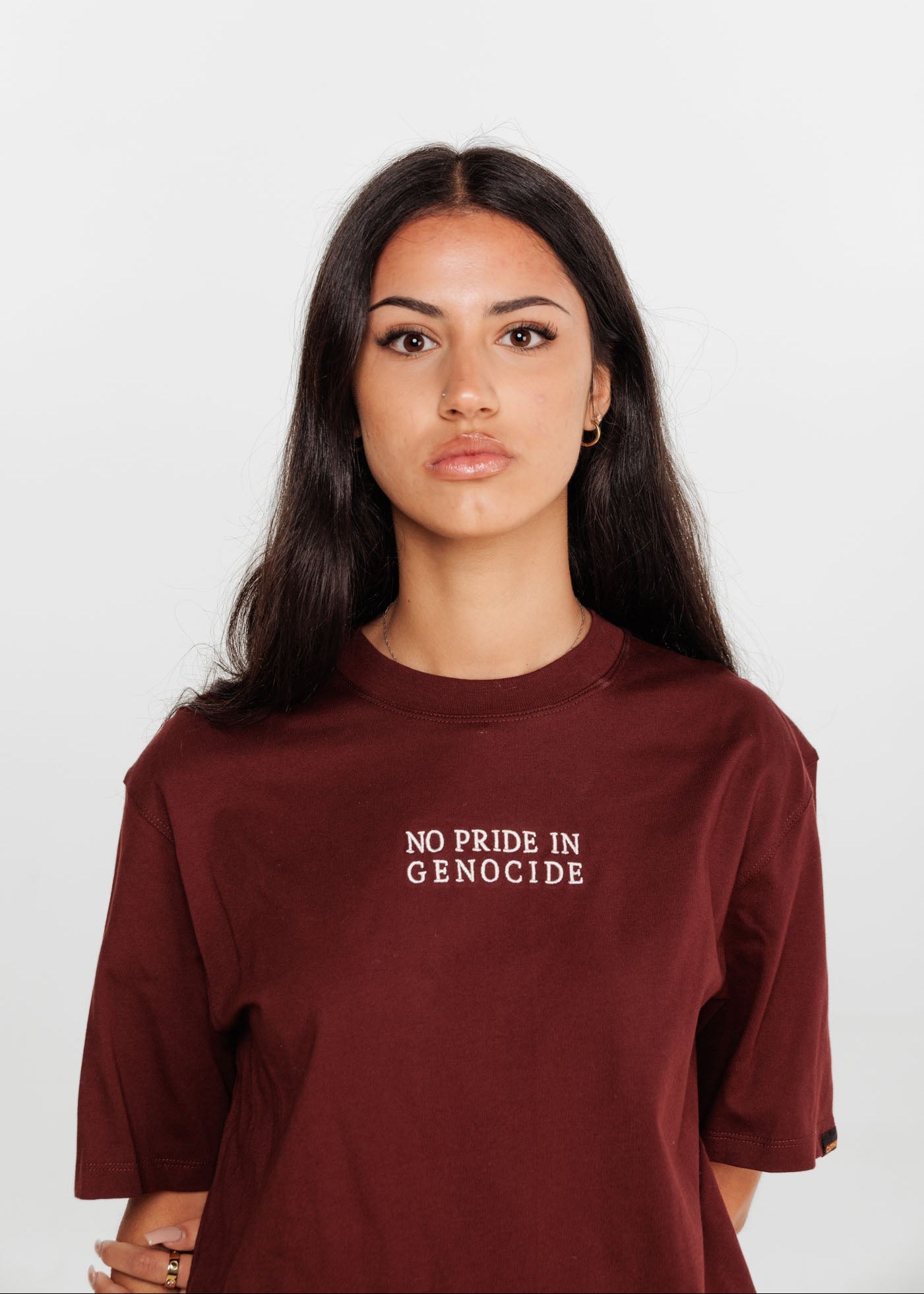 No Pride In Genocide tee in burgundy. Clothing The Gaps.