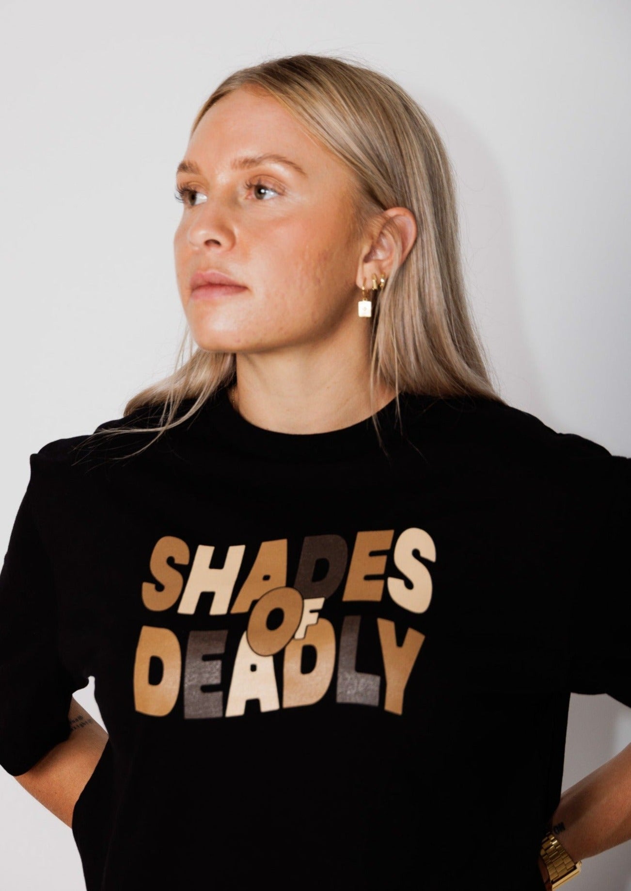 Clothing The Gaps. Shades of Deadly. Mob only T-shirt. Black T-shirt with 'Shades of Deadly' Screen printed on the front chest area with letters in different shades of brown and tan colours. 