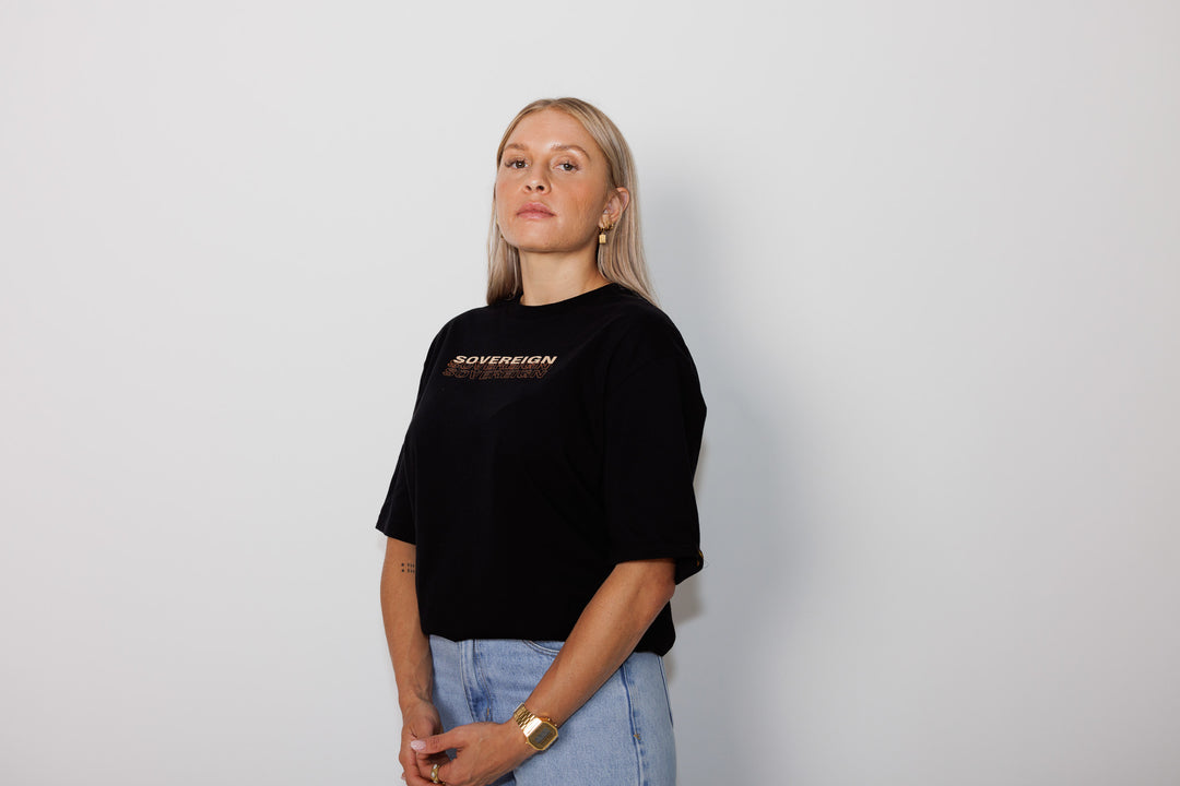 Clothing The Gaps. Sovereign tee. Mob only T-shirt. Black t-shirt with bold cream text across chest reading 'sovereign.' Below is a brown shadow outline of the word.
