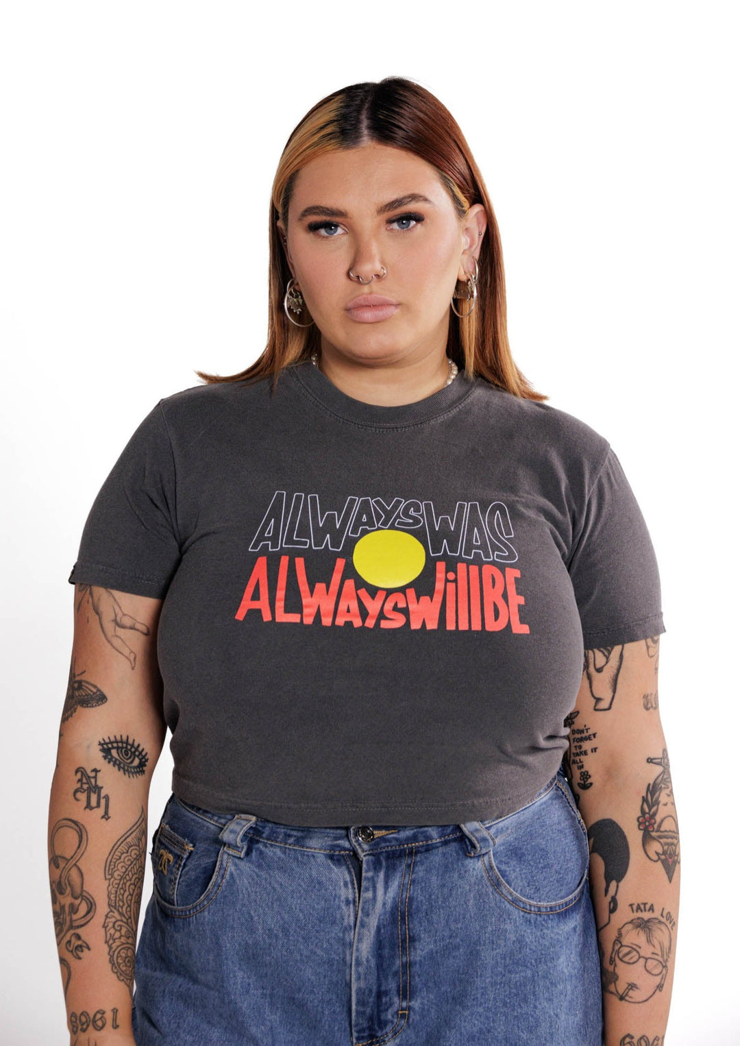 Clothing The Gaps. Vintage Crop Always Was Always Will Be Tee. Washed Grey cropped t-shirt with Black, yellow and red 'always was always will be' text screen printed in centre.