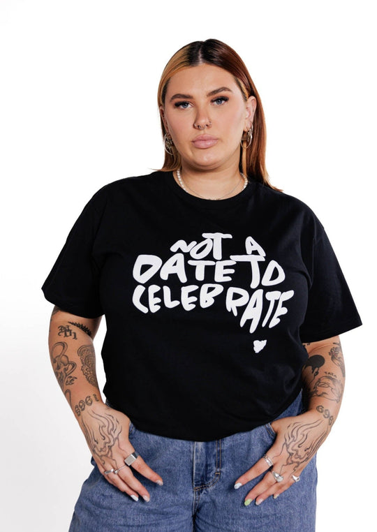 Clothing The Gaps. Not A Date To Celebrate Tee. Black tee with screen printed 'Not A Date To Celebrate' white text in the shape of Australia big on the front chest of t-shirt.