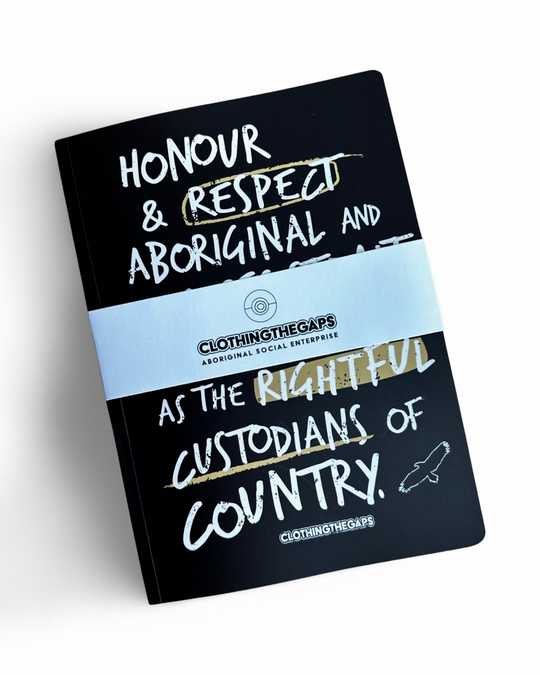Clothing The Gaps. Honour Country Notebooks. Inside lined page on one side and blank page on other. All front covers have  the statement 'Honour and respect Aboriginal and Torres Strait Islander people as the rightful custodians of country.' Available in a pink background with red text, chocolate brown background with light brown text, black background with white text and green background with white text.