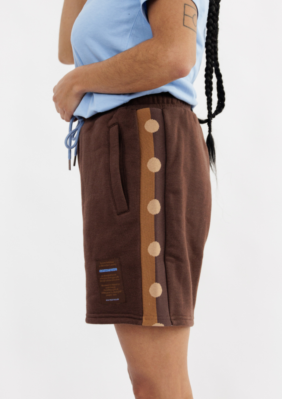 Clothing The Gaps. Chocolate Flag Shorts. Chocolate brown shorts with tonal (using lighter browns) Aboriginal flag tape down the sides. Has a elastic waist with light blue draw strings and deep pockets on Bothe sides.