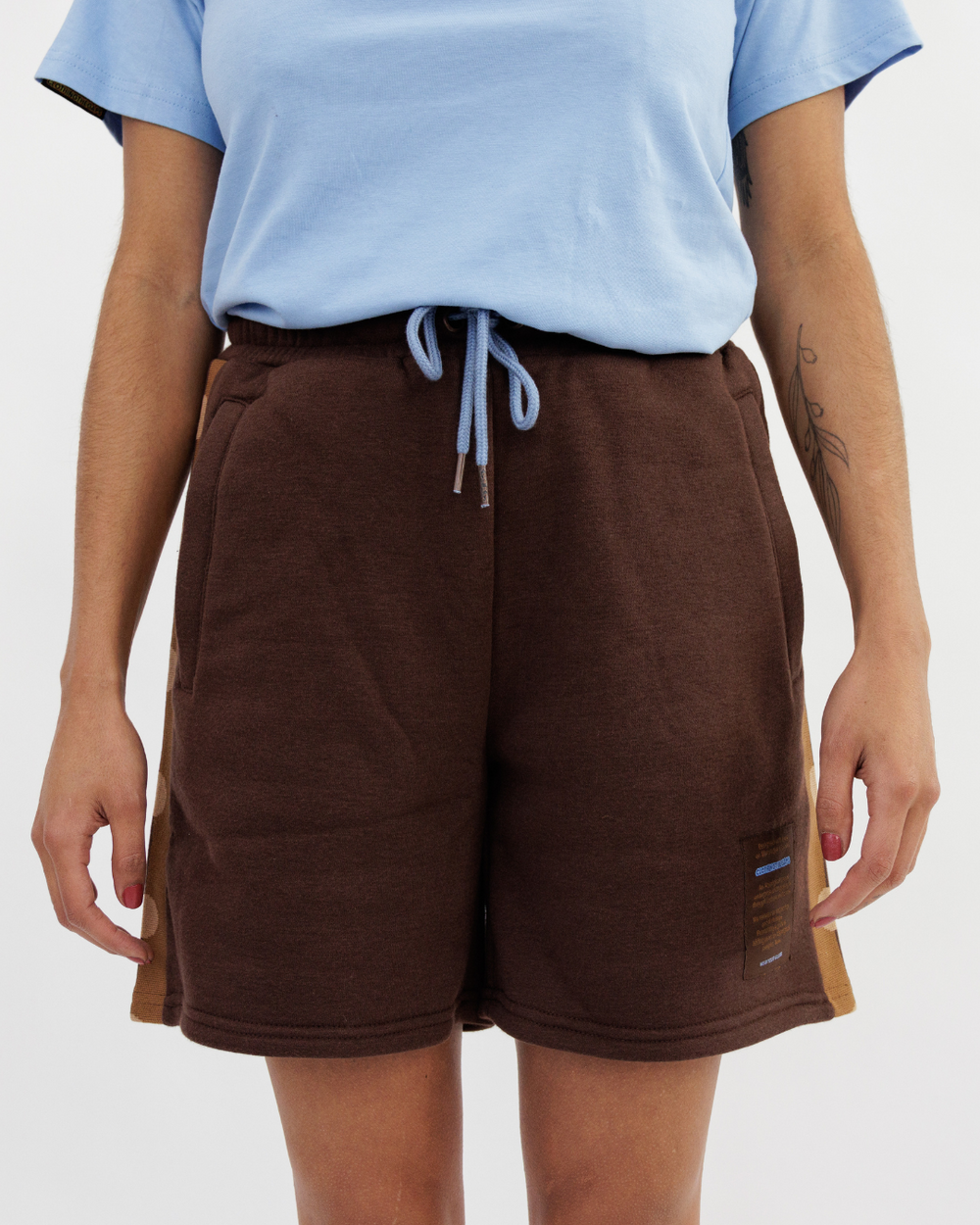 Clothing The Gaps. Chocolate Flag Shorts. Chocolate brown shorts with tonal (using lighter browns) Aboriginal flag tape down the sides. Has a elastic waist with light blue draw strings and deep pockets on Bothe sides.