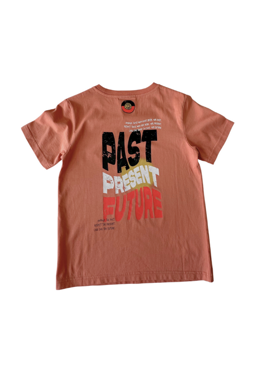 Clothing The Gaps. Kids Past Present Future Tee. Light peachy coloured tee with a small 'Past, Present, Future' pocket square on the front and large 'Past, Present , Future screen print back Black white and red with a yellow sun behind.