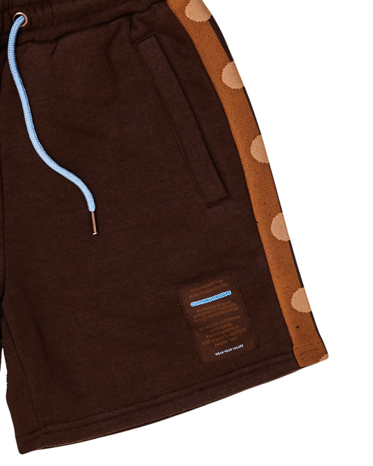 Clothing The Gaps. Chocolate Flag Shorts. Chocolate brown shorts with tonal (using lighter browns) Aboriginal flag tape down the sides. Has a elastic waist with light blue draw strings and deep pockets on Bothe sides.