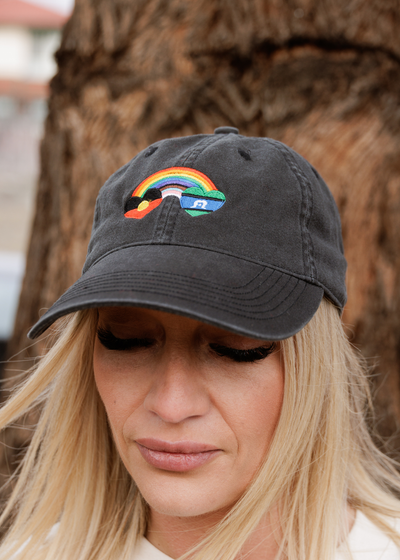 Blak Rainbow Luv cap in faded black with embroidered rainbow and First Nations flags. Clothing The Gaps.