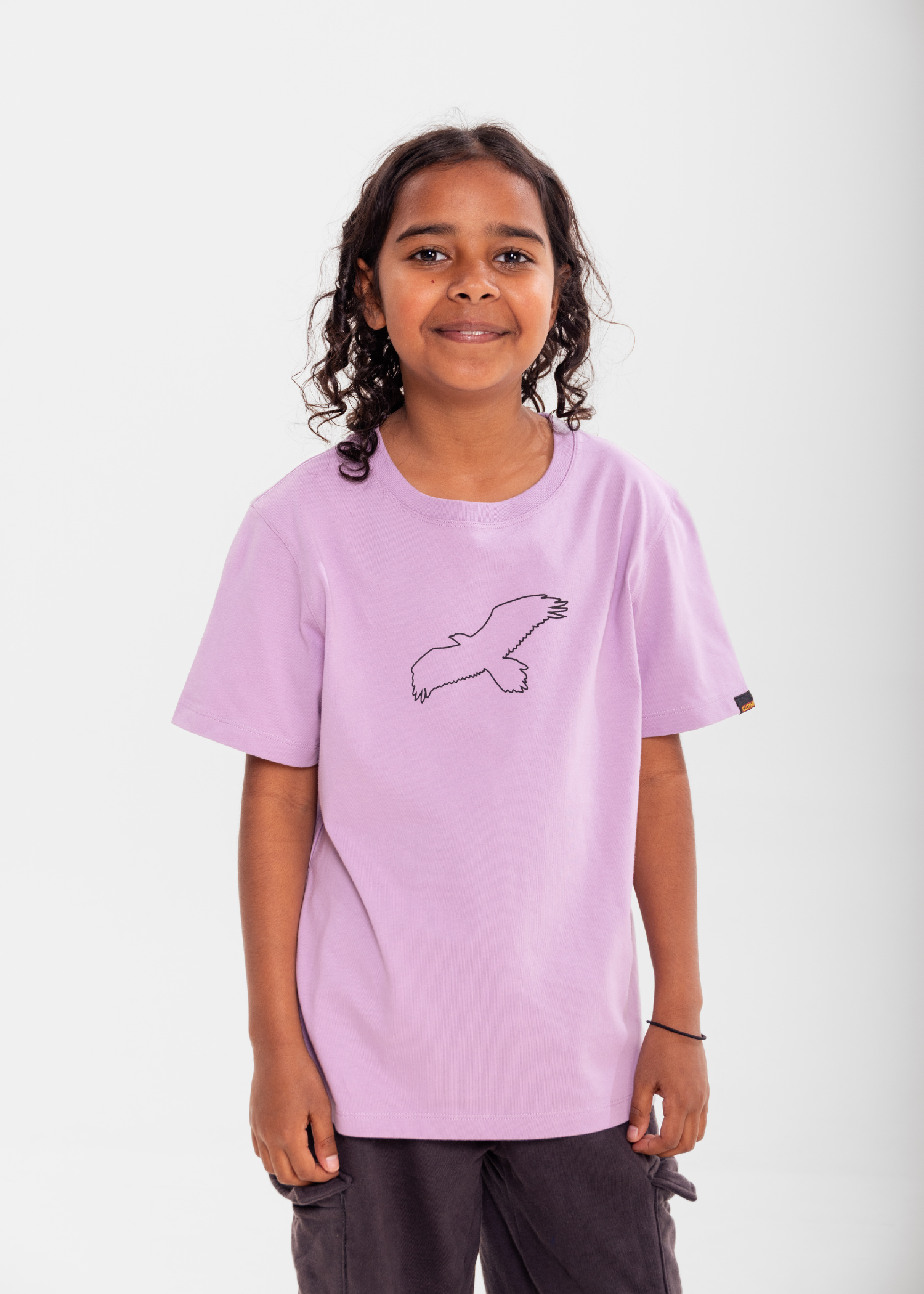 Kids Bunjil Icon tee in lilac featuring the wedge-tailed eagle. Clothing The Gaps.