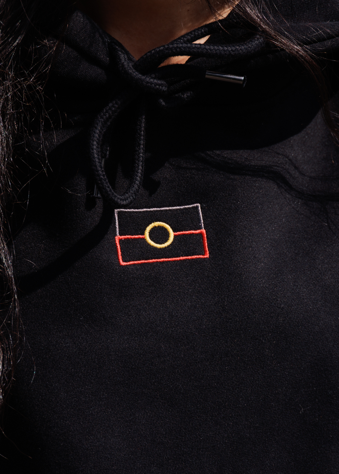 Close up embroidered Aboriginal flag on hoodie chest