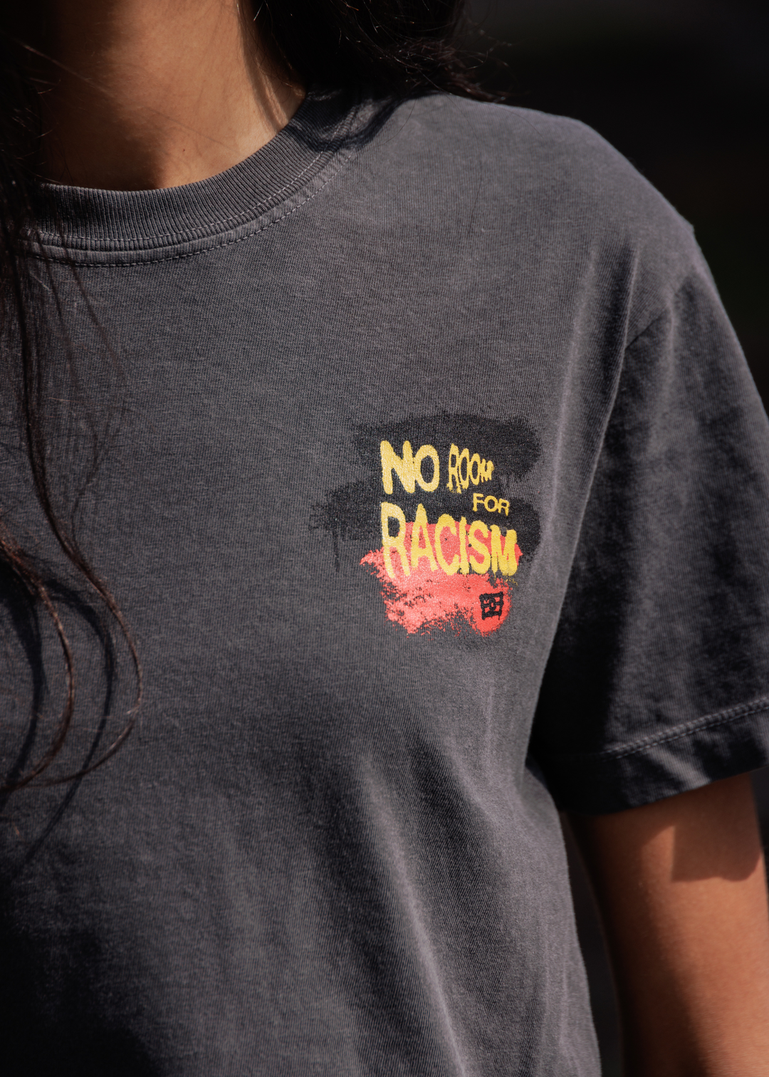 Close up of vintage wash cotton fabric on boxy fit t-shirt