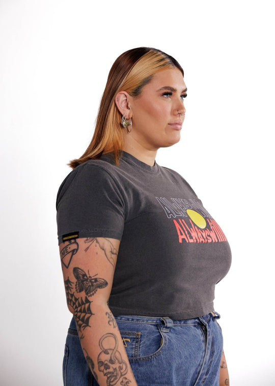 Clothing The Gaps. Aboriginal Flag Vintage Crop Always Was Always Will Be Tee. Washed Grey cropped t-shirt with Black, yellow and red 'always was always will be' text screen printed in centre.