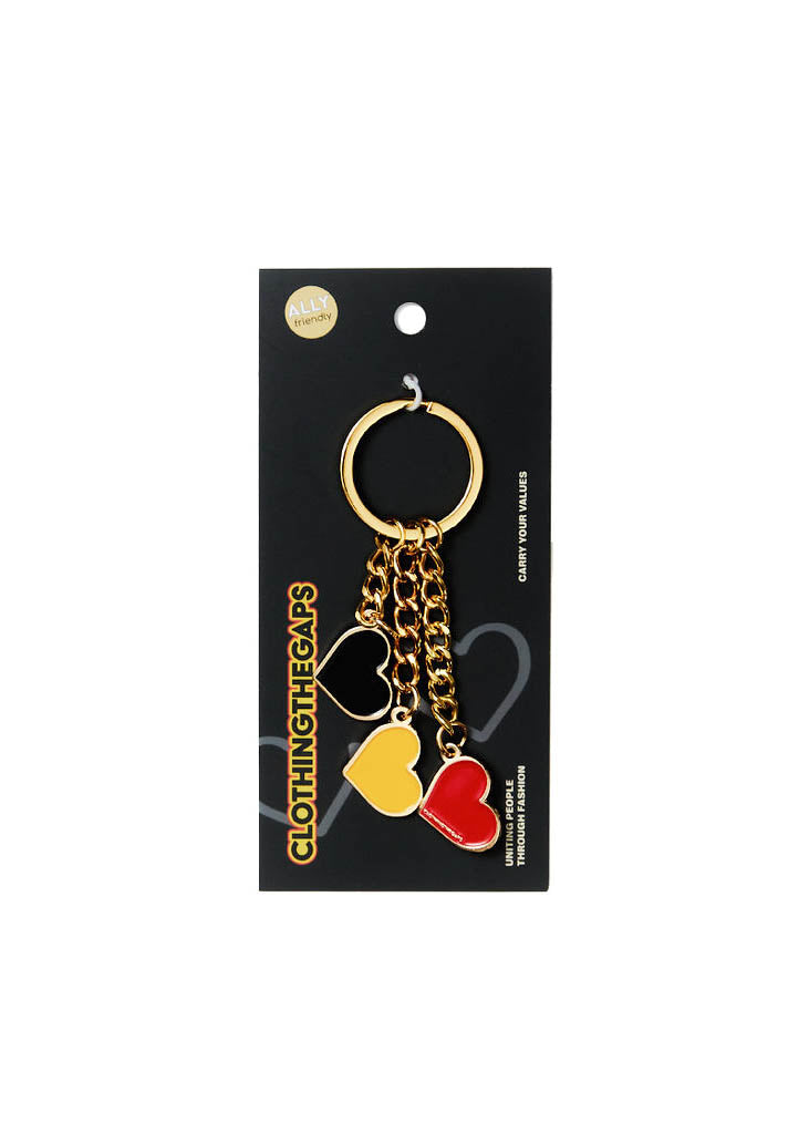 Clothing The Gaps. Blak Luv Keyring.  With gold chain and loop attached to 3 seperate hearts in the colours of the Aboriginal flag Black, yellow and red.