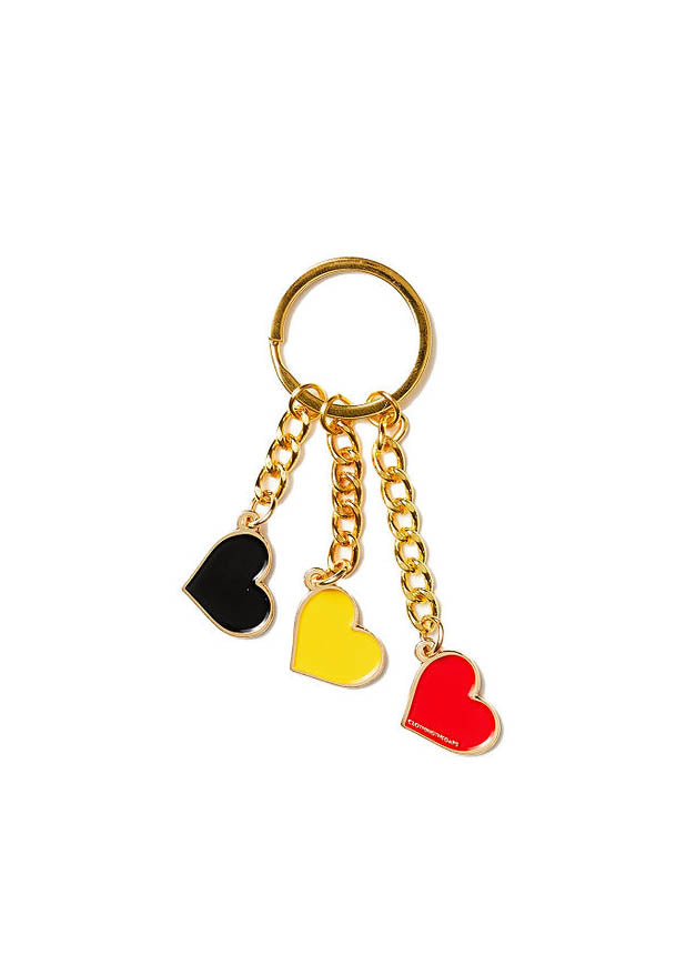 Clothing The Gaps. Blak Luv Keyring.  With gold chain and loop attached to 3 seperate hearts in the colours of the Aboriginal flag Black, yellow and red.