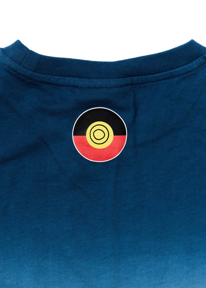 Clothing The Gaps. Kids Dip Dye 'Always Was, Always Will Be' Tee. Blue died t-shirt that fades down from the top of t-shirt to lighter blues then a cream white. With a Black, yellow and red 'always was always will be' text screen printed in left corner pocket sized.