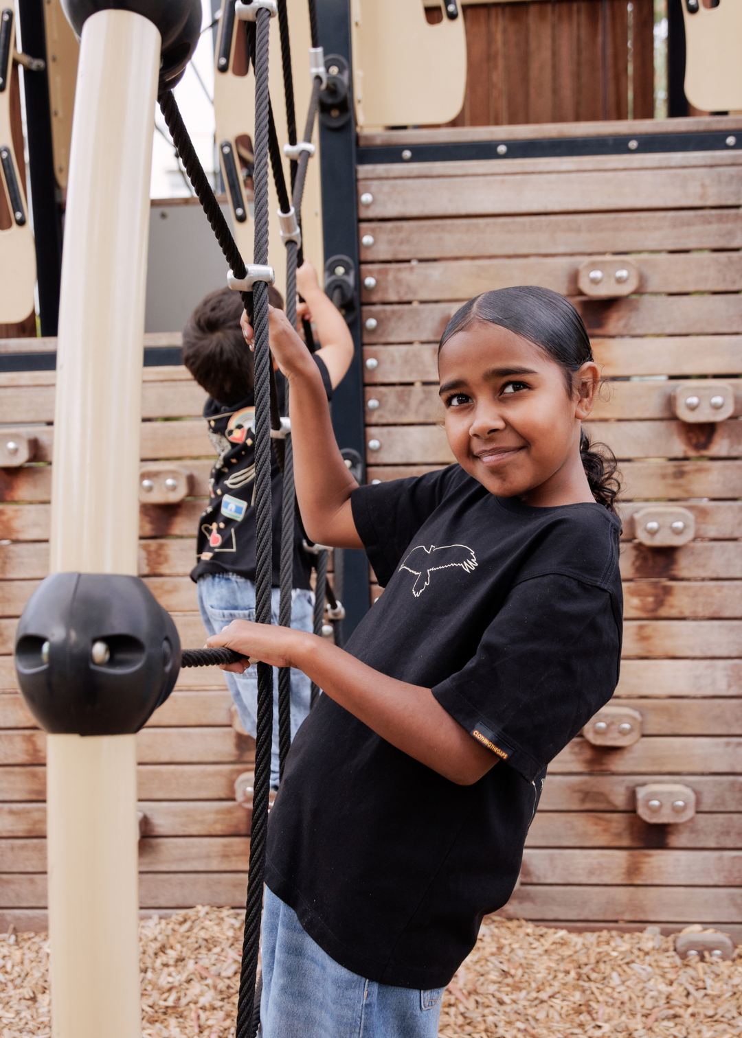 Clothing The Gaps Kids Bunjil Icon Tee Black — Bunjil Kulin Nation Aboriginal Flag Decolonised Map Wear Your Values Aboriginal Owned Melbourne
