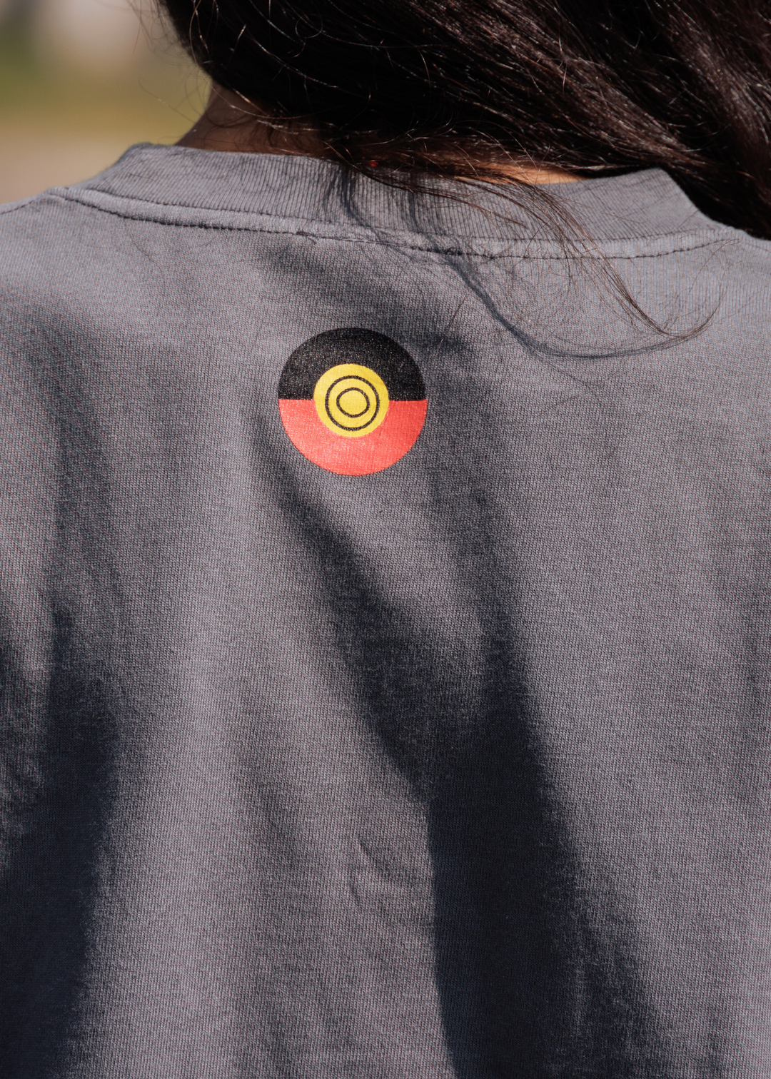 Clothing The Gaps No Room For Racism Oversized Tee — Grey Organic Cotton Spray Paint Print Aboriginal Flag Outline Anti Racism Aboriginal Business Narrm