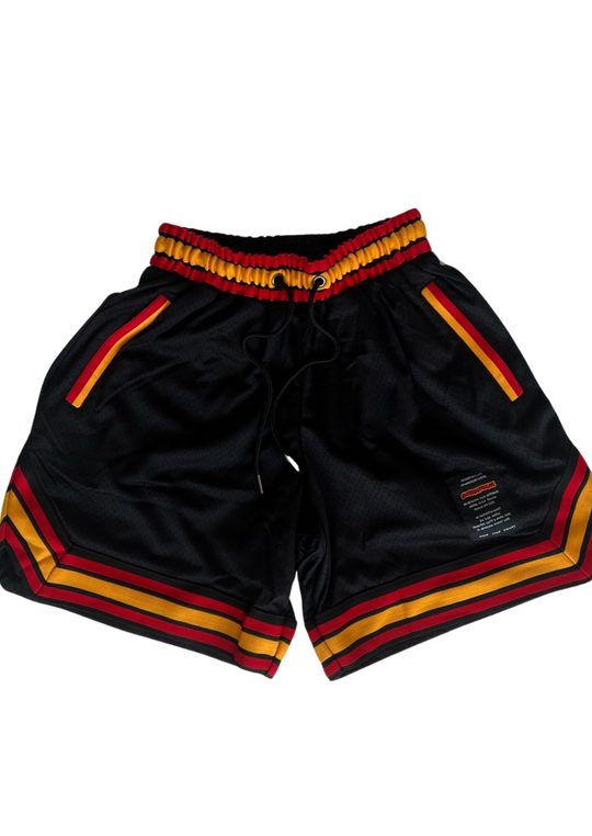 Clothing The Gaps. Blak Basketball Shorts. Retro look with red, black and yellow stripes around bottom of shorts, on pocket opening and around waist band. Rest of the shorts are a black mesh material. Has a elastic waist, black drawstrings, deep pockets and clothing the gaps patch on corner of left leg.