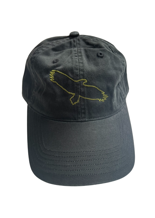Clothing The Gaps. Bunjil cap. Washed black cap with a light green embroidered outline of Bunjil, a well-known wedge tailed eagle who is the spiritual creator and protector of the Kulin Nation in Victoria. Clothing The Gaps is embroidered in the same light green on the back. Has a pony tail loop and a adjustable Velcro strap at back of cap.