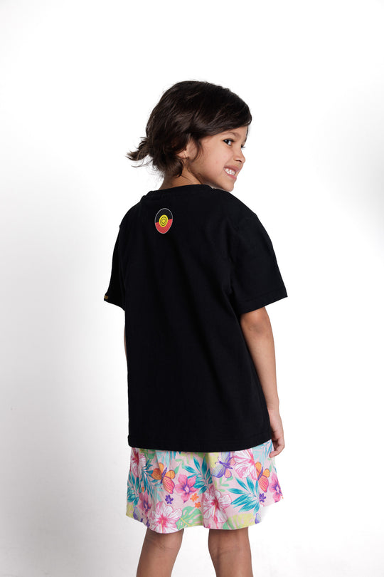 Clothing The Gaps. Aboriginal Tee Black kids short sleeve T-shirt with Black, yellow and red 'always was always will be' text screen printed in centre.