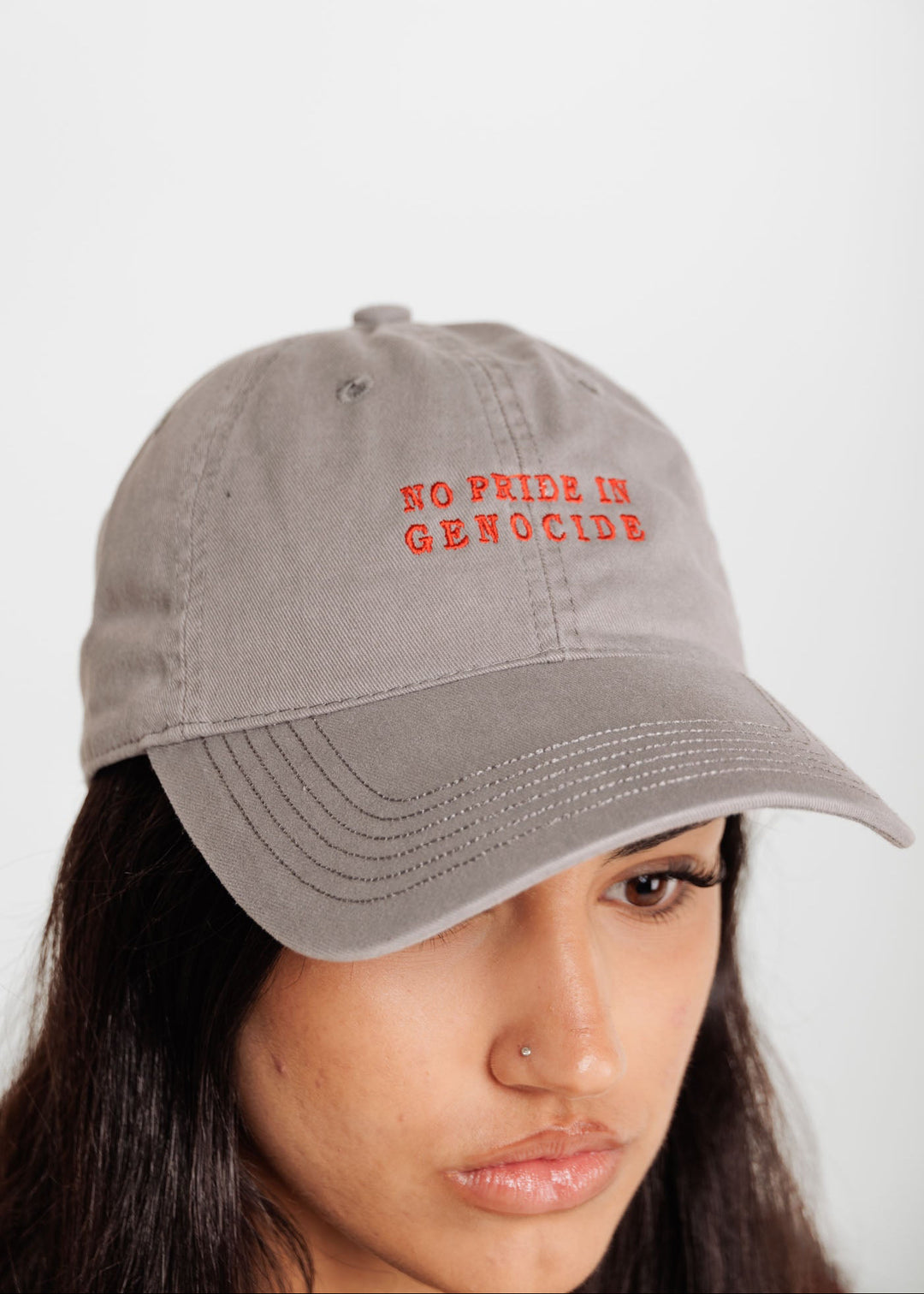 front of No Pride in Genocide cap clothing the gaps 