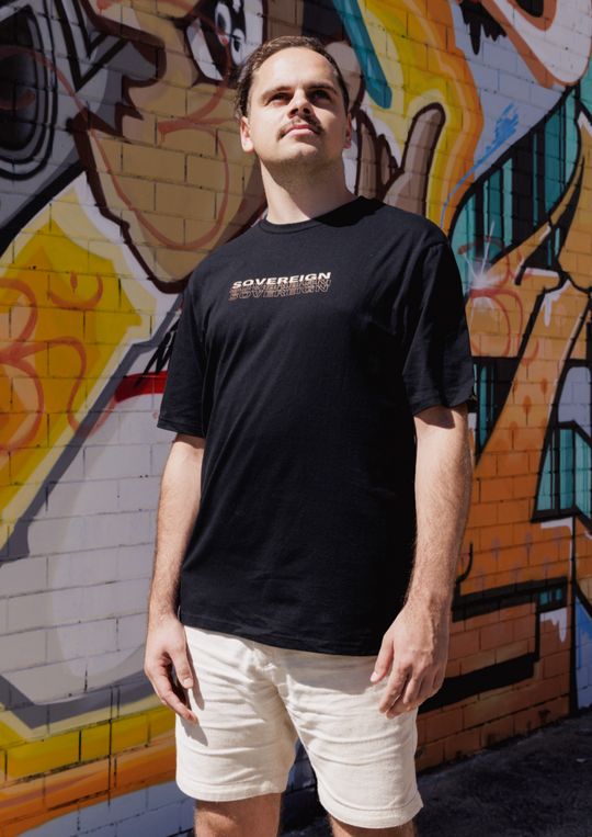 Clothing The Gaps. Sovereign tee. Mob only T-shirt. Black t-shirt with bold cream text across chest reading 'sovereign.' Below is a brown shadow outline of the word.