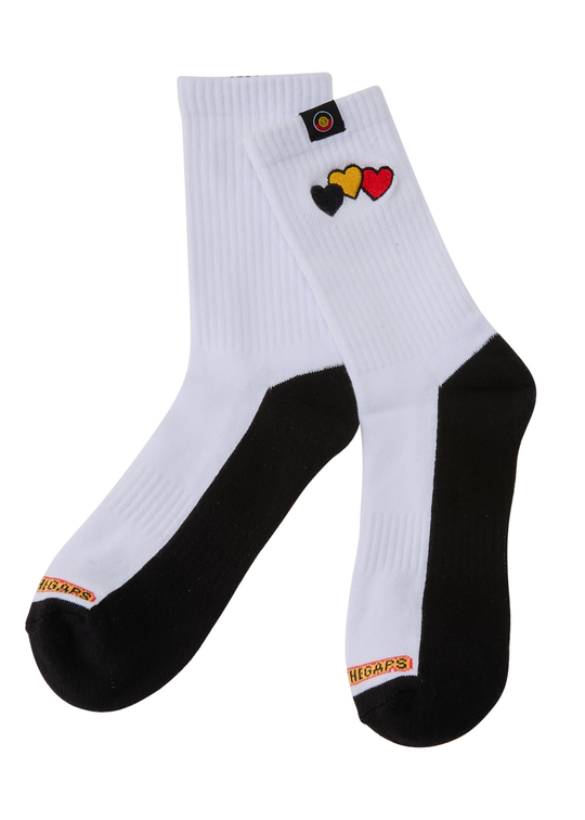 White socks with black toes and heels, featuring colorful heart designs on a white background.