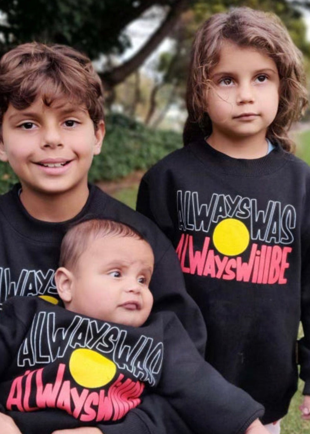 Clothing The Gaps. Black kids crew neck jumper with Black, yellow and red 'always was always will be' text screen printed in centre.