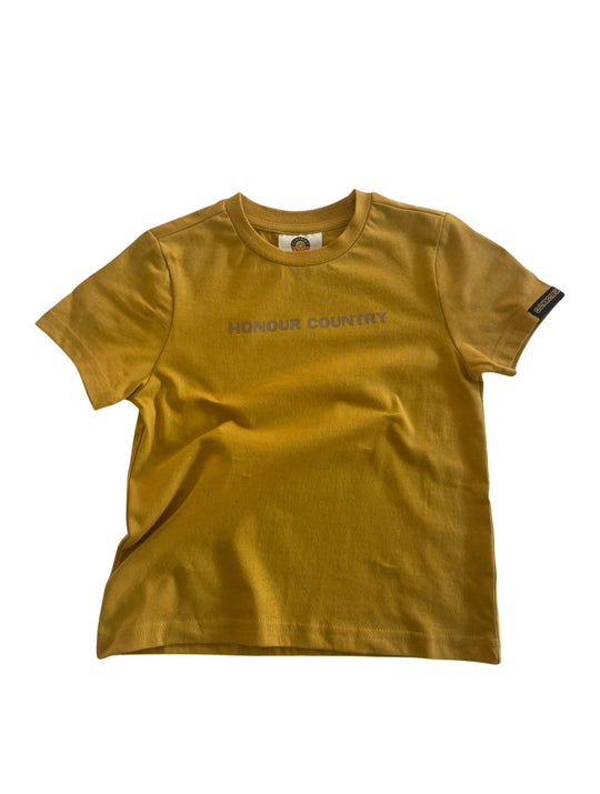 Clothing The Gaps. Kids Mustard Honour Country Tee. Mustard yellow t-shirt with screen printed bold capital text 'Honour and respect Aboriginal and Torres Strait Islander people as the rightful custodians of country.' The word 'Honour country' on the front in the same text and contrasting colour.