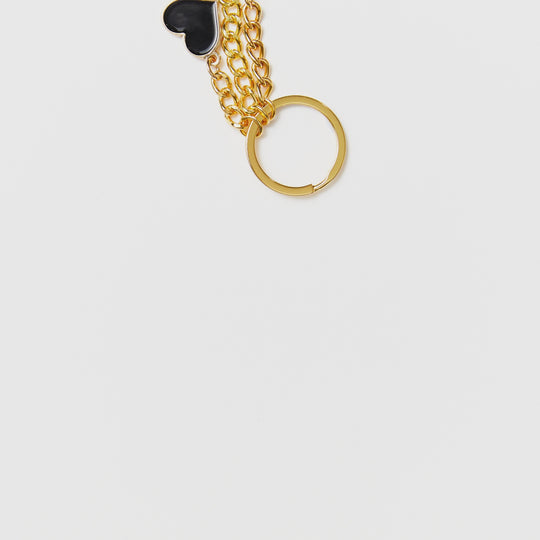 Clothing The Gaps. Blak Luv Keyring.  With gold chain and loop attached to 3 seperate hearts in the colours of the Aboriginal flag Black, yellow and red.