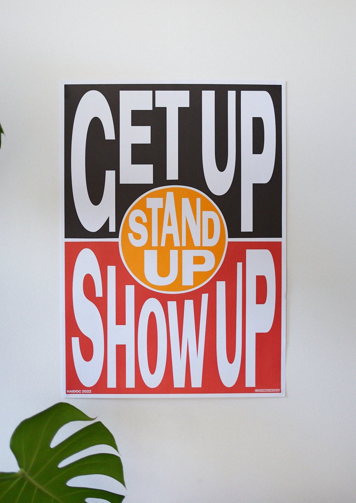 Clothing The Gaps. Get Up! Stand Up! Show Up! Poster DIGITAL DOWNLOAD. Aboriginal Flag Background with 'Get Up' in black section of flag 'Stand Up' in yellow section and 'Show Up' in red section.All text in bold white capital letter.
