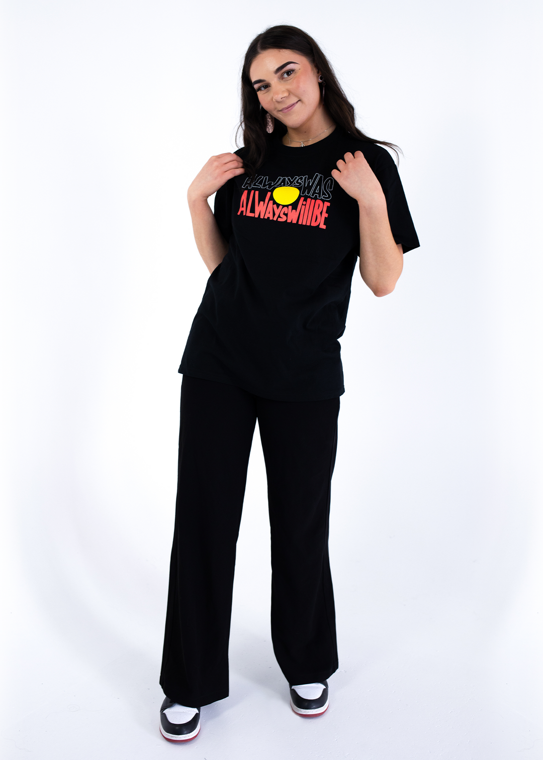 Clothing The Gaps. Black T-shirt with Black, yellow and red 'always was always will be' text screen printed in centre.