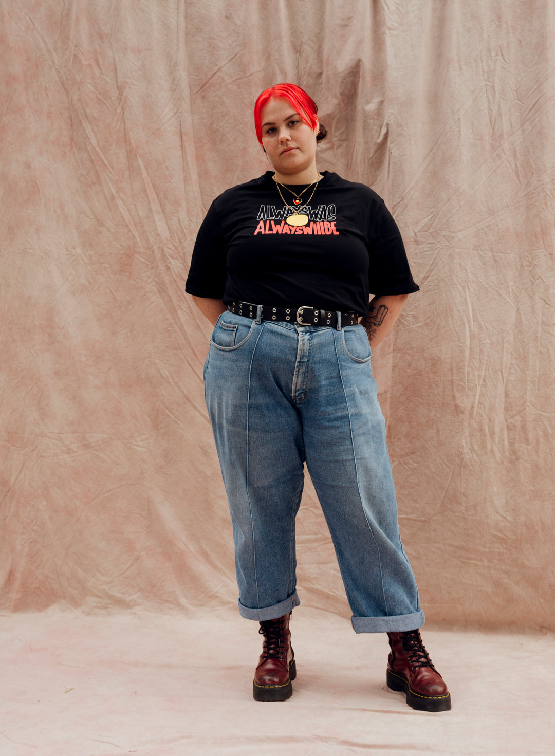 Clothing The Gaps. Aboriginal fag tee Black T-shirt with Black, yellow and red 'always was always will be' text screen printed in centre.