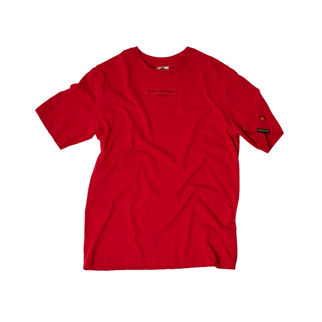 Clothing The Gaps. Land Tee. Red T-shirt. With embroidered 'Clothing The Gaps' on front chest with minimalist font in a contrasting light red colour and 'Narrm' in a dark red embroidered underneath, acknowledging the land on which Clothing The Gaps operates it's social enterprise.