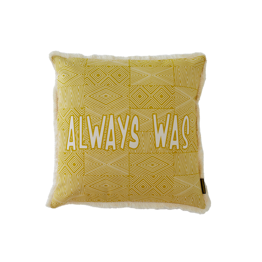 Clothing the Gaps. Cushion covers available in red, orange and yellow. With aboriginal possum skin cloak designed back ground and words 'always was' on one side and 'always will be' on the other. 
