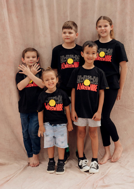 Clothing The Gaps. Black kids short sleeve T-shirt with Black, yellow and red 'always was always will be' text screen printed in centre.